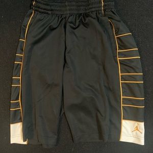 Black Jordan Shorts with gold and white outline